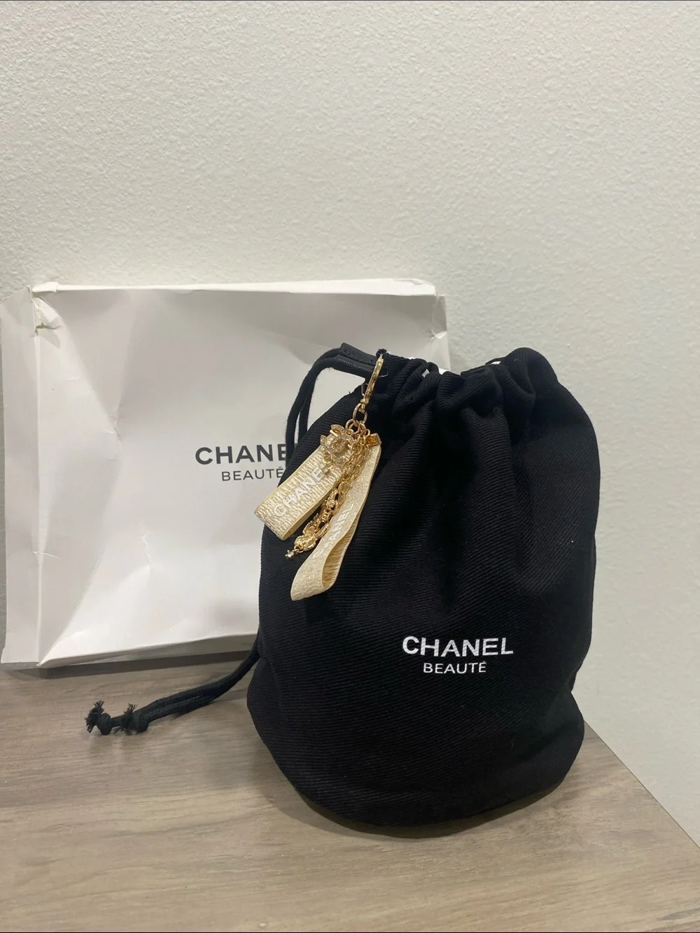 CHANEL Black Drawstring Cosmetic Pouch with Gold Charm